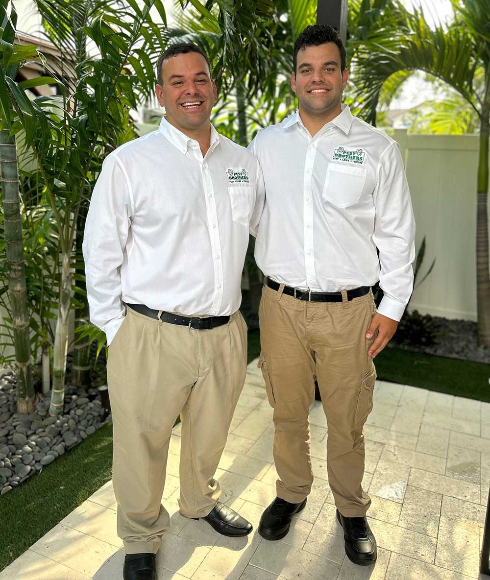 Jose and Michael Rodriguez, the Pest Brothers, in uniform